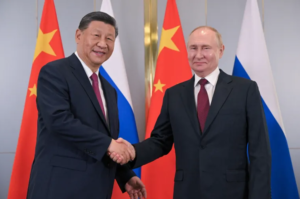 President Xi, left, meets President Putin on the sidelines of the Shanghai Cooperation Organisation summit in Astana 